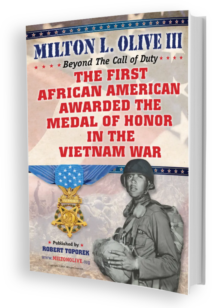 A book cover with an image of a man and a medal.